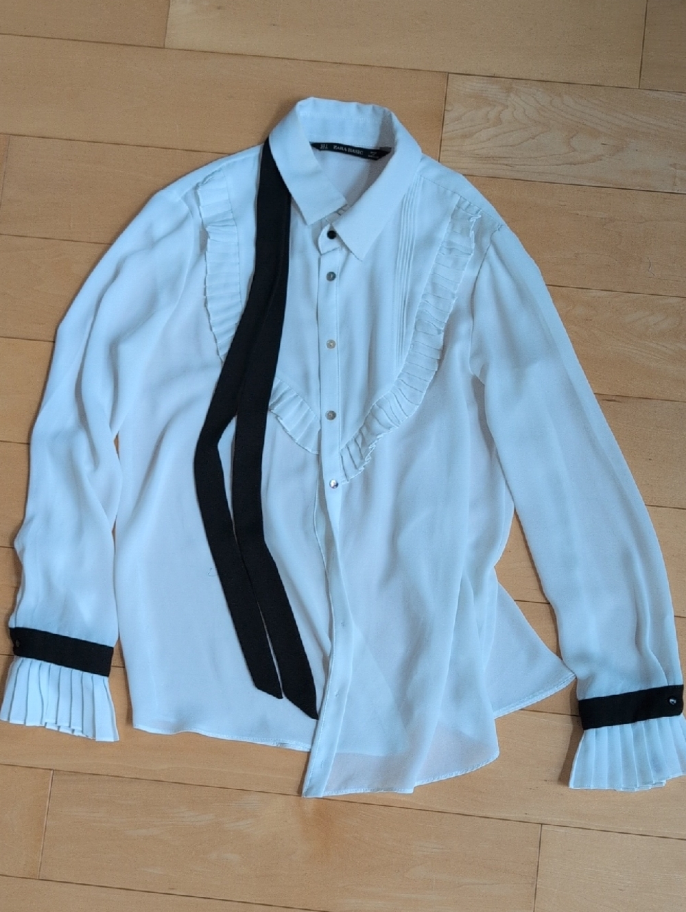 White Ruffled Blouse with Blue Tie Detail